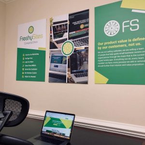FreshySites desk and posters in Raleigh, NC office